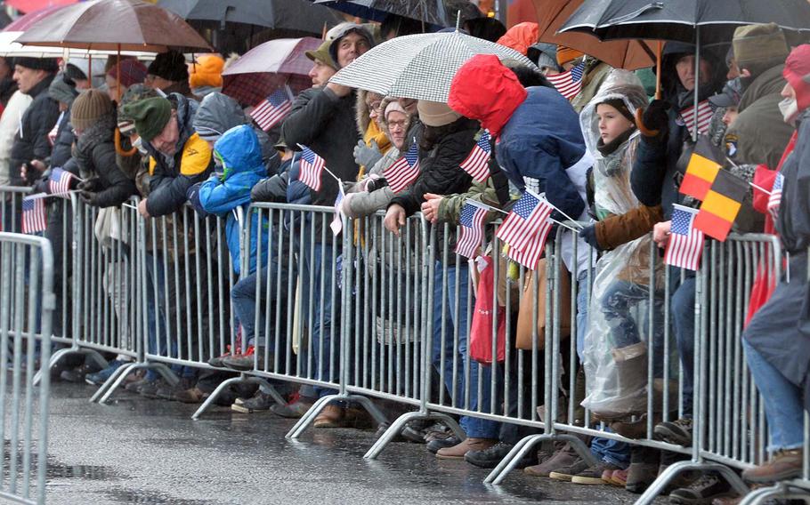 Spectators, many with American flags, line the main street of Bastogne, Belgium, as the parade marking the 75th anniversary of the World War II Battle of the Bulge begins, Saturday, Dec. 14, 2019.