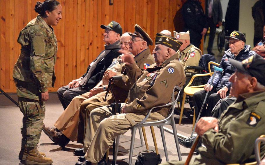 A soldier talks to Battle of the Bulge veterans before a ceremony marking the 75th anniversary of the bloody World War II battle. More than 30 veterans turned up for the event.