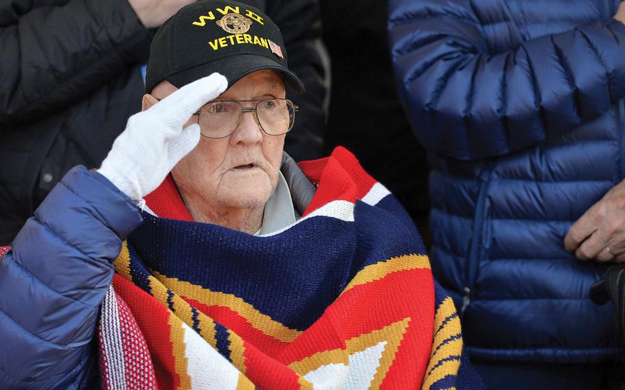 World War II veteran Francis X. Murphy sings and salutes during the playing of the national anthem at the conclusion of a 75th anniversary of the Battle of the Bulge ceremony at the 106th Infantry Division monument in St. Vith, Belgium, on Sunday, Dec. 15, 2019.