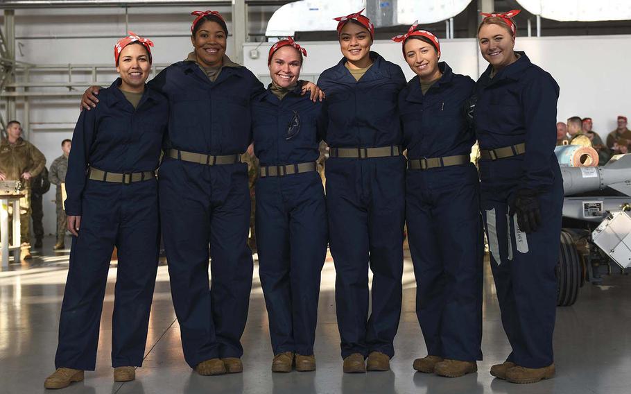 From left, U.S. Air Force Staff. Sgt. Ana Merkel, Staff Sgt. Catharyn Clyde, Staff Sgt. Nicole Jarvis, Senior Airman Audrey Naputi, Airman 1st Class Ashlyn Martin and Airman Erin Brumm pose at Aviano Air Base, Italy, Jan. 7, 2020. The team members dressed as Rosie the Riveter to represent women who worked in factories and shipyards, producing munitions and war supplies during World War II.