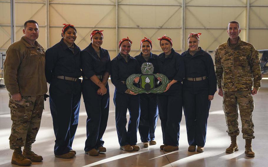 U.S. airmen from the 31st Munitions Squadron and the 731st Munitions Squadron pose with leadership for a photo at Aviano Air Base, Italy, Jan. 7, 2020. The ''Bouncing Bettys'' team had the best score of the teams taking part in Aviano's RAGE competition and will have their names etched on plaques.

