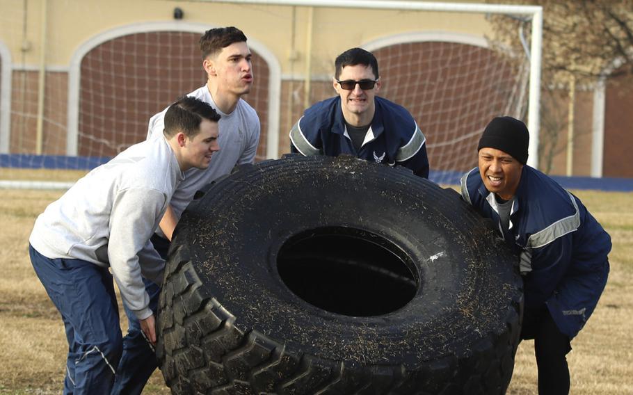 Airmen with the 31st Fighter Wing, Aviano Air Base, Italy, work as a team to tackle one of the challenges in the Amazing Wyvern Race event on Friday, January 31, 2020. 


