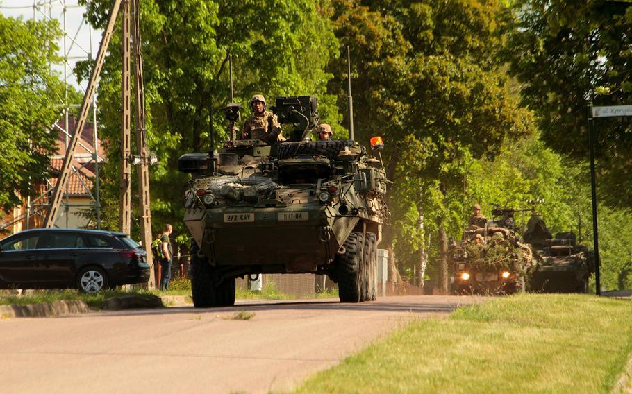 Armored vehicles roll down ulica Ketrzynskiego, the main street in the small Polish village of Bemowo Piskie, in May 2017. A U.S.-led NATO enhanced Forward Bemowo Presence battle group, aimed at deterring Russian aggression, has been based since 2017 in the training area near Bemowo Piskie. 
Courtesy xxxxxxx / Bemowo Piskie Schlagakrug Facebook Page