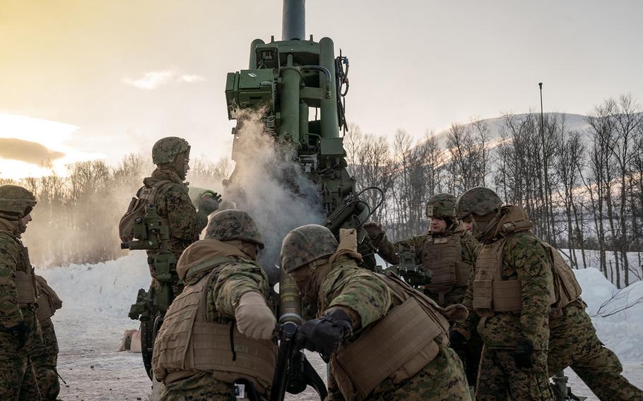 U.S. Marines from 2nd Battalion, 10th Marine Regiment, load a high-explosive round into an M777 Howitzer during a live-fire range near Setermoen, Norway, March 4, 2020.