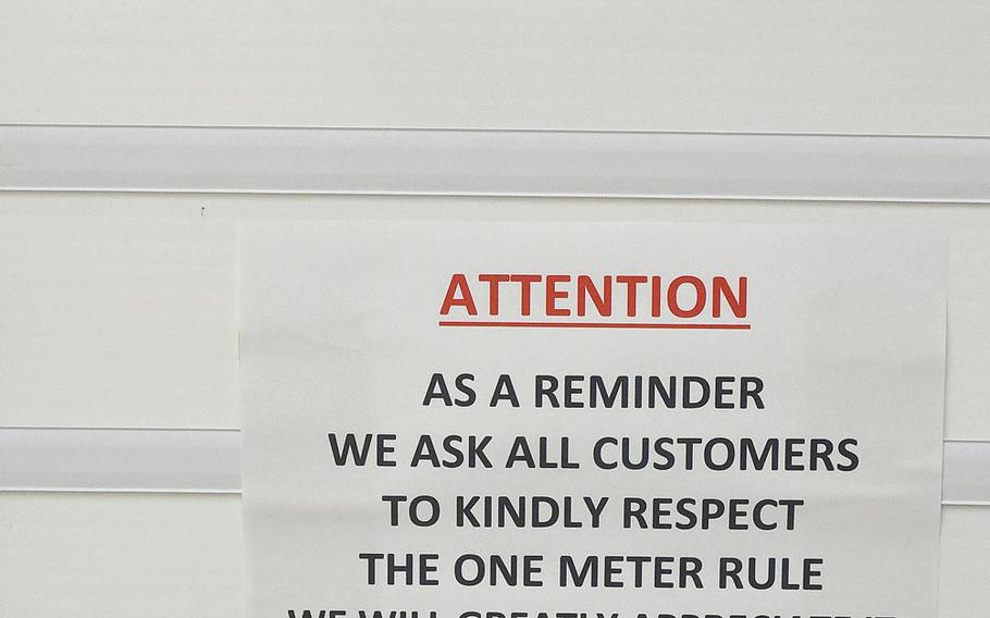 A sign at the Defense Commissary Agency store in Aviano Air Base, Italy, reminds patrons to keep a 1-meter distance while shopping.

