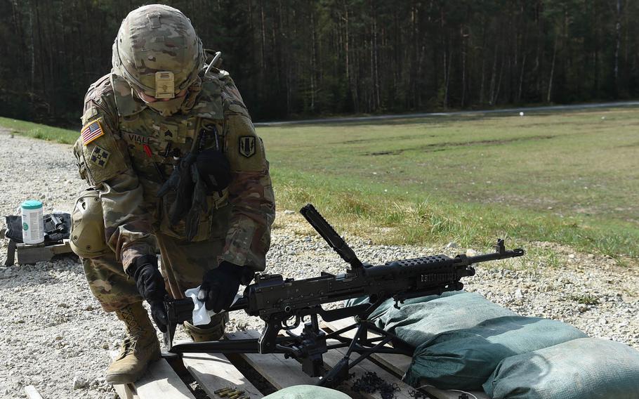 Sgt. Christopher Viall, a wheeled vehicle mechanic with the 41st Field Artillery Brigade, wipes down an M240B machine gun during an exercise at Grafenwoehr Training Area, April 17, 2020.

