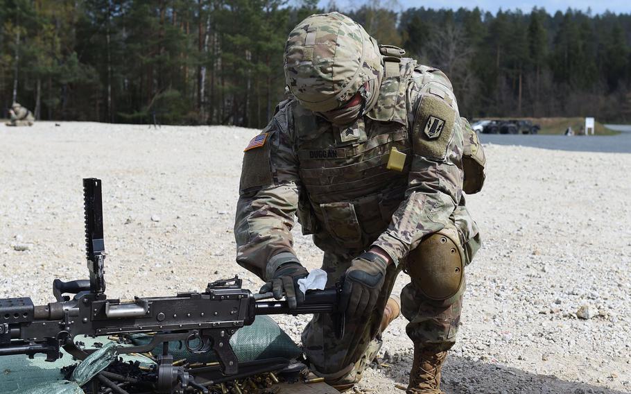 Sgt. Eamonn Dugan, an intelligence analyst with the 41st Field Artillery Brigade, wipes down an M240B machine gun during an exercise at Grafenwoehr Training Area, Germany, April 17, 2020.

