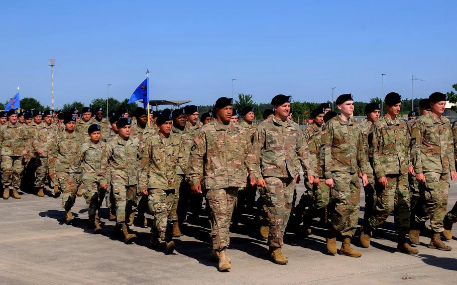 Soldiers with the 12th Combat Aviation Brigade march at Katterbach Army Airfield in Ansbach, Germany, in July 2019. President Trump says some troops currently in Germany could be moved to Poland.