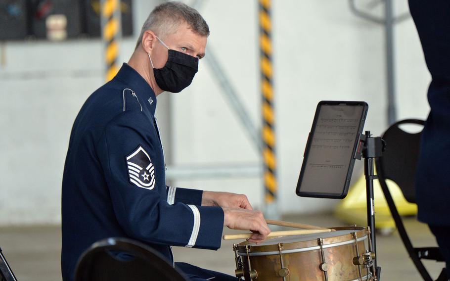 Master Sgt. Timothy Stombaugh, a drummer with the USAFE band, keeps his eye on a bandmate as they entertain before the 86th Airlift Wing change of command ceremony at Ramstein Air Base, Germany, Aug. 7, 2020. 










