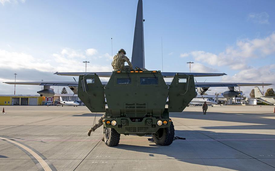 Soldiers assigned to 1st Battalion, 77th Field Artillery Regiment unload High-Mobility Artillery Rocket Systems from 352nd Special Operations Wing's U.S. Air Force MC-130J Commando II as part of exercise Rapid Falcon in Romania, Nov. 19, 2020.