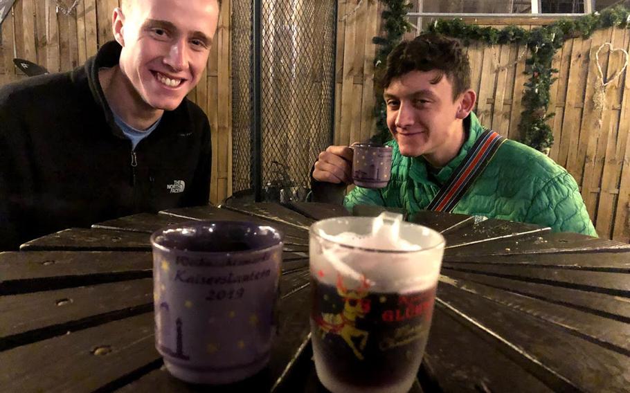 Air Force Academy cadets Luca Zeitvogel, left, and Marcos Ferreira sample gluehwein at the Christmas market in Kaiserslautern, Germany, on Dec. 18, 2019. Germany has partially lifted a months-old coronavirus travel ban on Americans to allow U.S. children whose parents have SOFA status and are assigned to the country to visit over the holidays. They will have to abide by local coronavirus rules, including quarantine and mask-wearing, and most Christmas markets will be closed.

