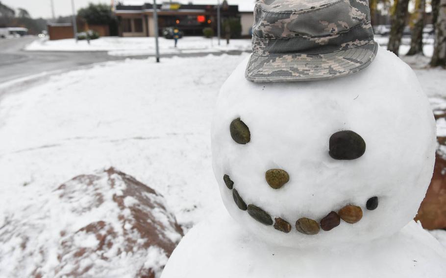 An airman had time to make a snowman decked in a battle dress uniform cap and a face made of rocks on Tuesday, Dec. 1, 2020, at Ramstein Air Base, Germany, as base personnel and the schools had a two-hour reporting delay due to the area's first snowfall of the winter season. 
