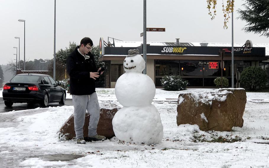 Airman 1st Class Jonathan Pereboom finishes his snowman by the roundabout at Harmon and Lawn avenues on Ramstein Air Base, Germany, Dec. 1, 2020. Personnel and the schools had a two-hour reporting delay due to the area’s first snowfall of the winter season.

