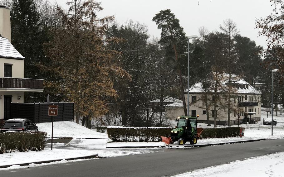 A snow plow clears a sidewalk in the Ramstein Air Base, Germany, housing areas after the area received its first snowfall of the season, Dec. 1, 2020. 

