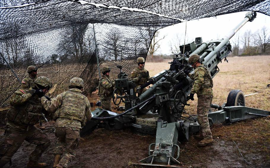 Soldiers with the Army's 2nd Cavalry Regiment demonstrate how to fire an M777 Howitzer, during an exercise in March 2019. U.S lawmakers are halting a Pentagon plan to remove 12,000 troops from Germany, according to a new defense bill. The regiment was one of the units slated to leave under the proposal.

