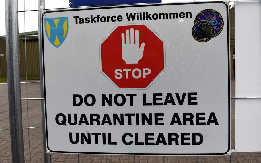 A sign marks the fenced-boundary of the Task Force Willkommen quarantine area at Rhine Ordnance Barracks in Kaiserslautern, Germany, Nov. 12, 2020.

