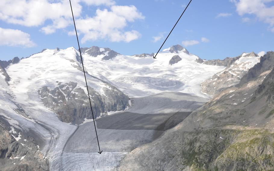 The Gauli Glacier seen from above in the summer of 2019. The arrow on the right indicates where a U.S. C-53 Skytrooper crash-landed in November of 1946, and the arrow on the left shows where parts of the aircraft emerged from the ice more than 70 years later. The fuselage is still buried in the ice but scientists believe it is near where the other pieces were recovered.

