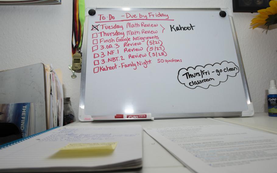 A third-grade Kaiserslautern Elementary School teacher, Shannon Blakely, noted tasks for remote learning on a dry-erase board at her home in May of 2020. KES's classrooms will be closed for two days, and in-person students are going back to remote learning through winter break. 