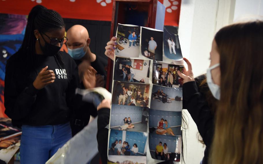 Ramstein High School seniors look over old photos left in a time capsule by the class of 2005, on Dec. 11, 2020. The students wore baggier, more comfortable-looking clothes, this year’s seniors noticed, and boot-cut jeans and skirts were in, they observed.

