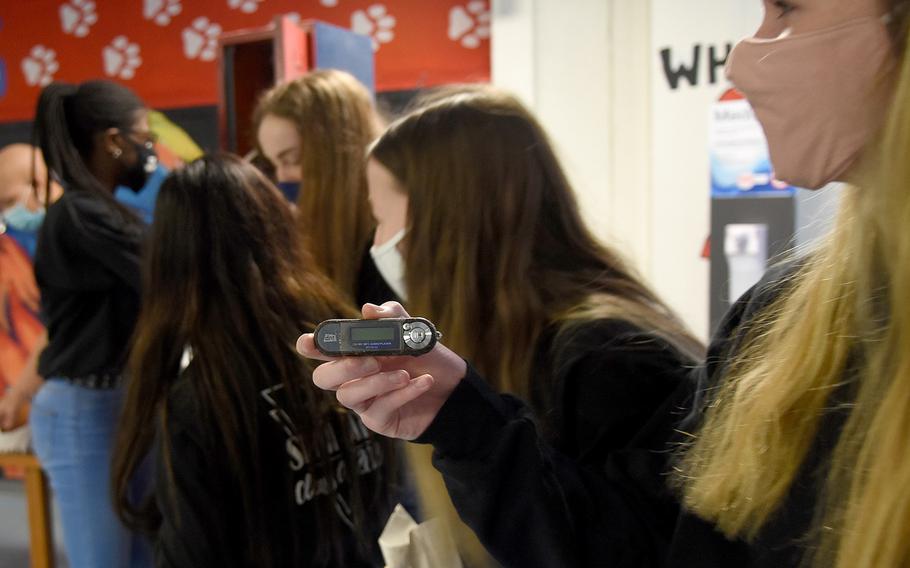 Ramstein High School Jamisen Casey holds an MP3 player, one of several relics left in a locker converted to a time capsule by the RHS Class of 2005. The school’s senior class officers opened the locker on Friday, Dec. 11, 2020.
