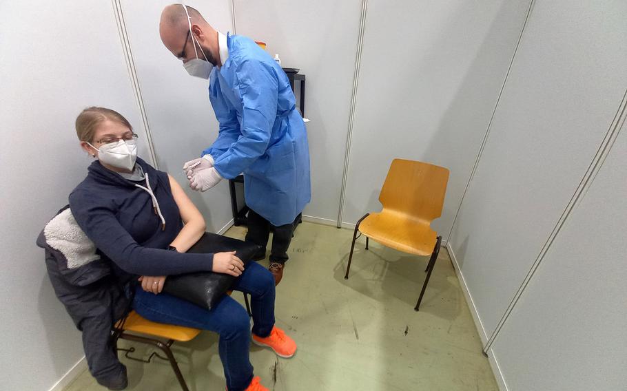 A simulation of how it will look when people receive their vaccine shots during a presentation for reporters at the coronavirus vaccination center in Kaiserslautern, Germany, Dec. 17, 2020.

