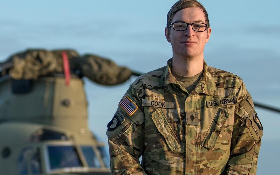 Army Spc. Bruce Cook, a CH-47F Chinook crew chief, stands in front of a helicopter at Storck Barracks in Illesheim, Germany, Dec. 16, 2020. Cook was was the one that initially witnessed a car accident from the air while flying back to Illesheim from a routine training mission. The Chinook landed in a field to provide medical assistance to the accident victim.


