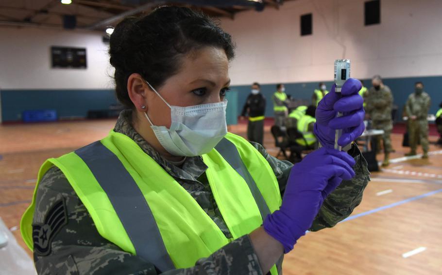 Staff Sgt. Jessica Campfield, an allergy immunizations technician with the 86th Airlift Wing, prepares a syringe of the Moderna vaccine Monday, Jan. 4, 2021, at Ramstein Air Base, Germany. 