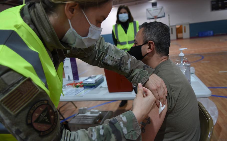 Chief Master Sgt. Alex Angulo, security forces manager for the 569th U.S. Forces Police Squadron, receives a first dose of the Moderna vaccine against COVID-19 on Monday, Jan. 4, 2021, at Ramstein Air Base, Germany.
