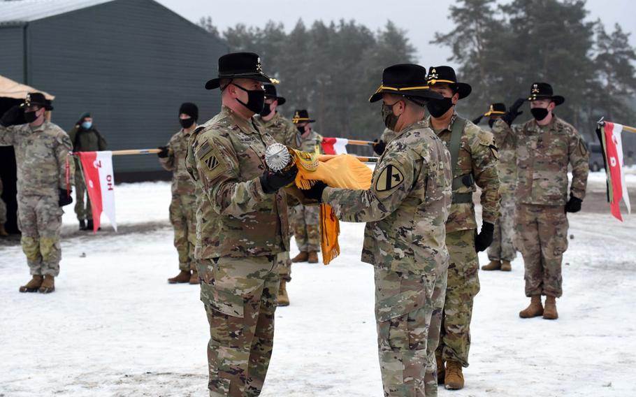 Soldiers from the 2nd Battalion, 8th Cavalry Regiment from Fort Hood, Texas, uncase the colors during a ceremony on Monday, Jan. 4, 2020, in Pabrade, Lithuania. The unit will spend the next eight months on a mission focused on deterring Russian aggression. 