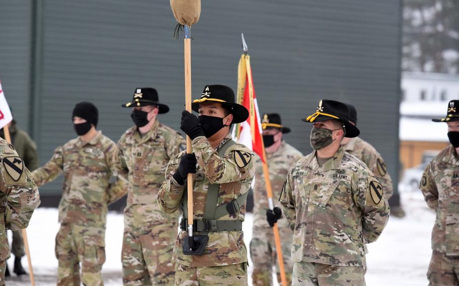 Soldiers from the 2nd Battalion, 8th Cavalry Regiment from Fort Hood, Texas, stand in formation as the unit's colors are uncased during a ceremony on Monday, Jan. 4, 2020, in Pabrade, Lithuania. The unit will spend the next eight months on a mission focused on deterring Russian aggression. 