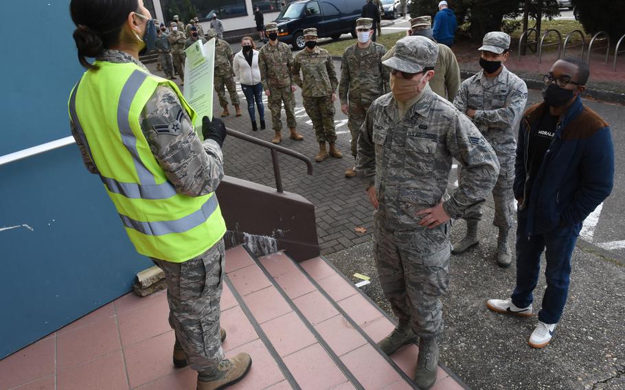 Airman 1st Class Sofia DeLeon screens airmen in line for the seasonal influenza vaccine outside the Southside Fitness Center Annex at Ramstein Air Base, Germany, on Dec. 8, 2020. The base expects to hold another mass influenza vaccination event next week for those who still have not received their flu shot. A large allotment of the vaccine was delayed getting to Europe this winter, leaving many Americans affiliated with the U.S. military community in Europe without a flu vaccine later than usual.


