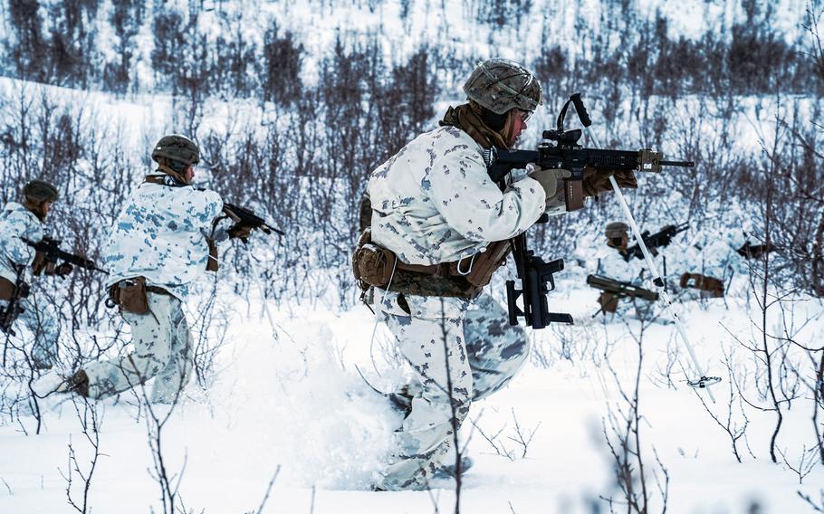Marines with Marine Rotational Force-Europe 21.1, Marine Forces Europe and Africa, maneuver during a cold-weather live-fire training event in preparation for Exercise Reindeer II in Setermoen, Norway, Nov. 20, 2020. More than 1,000 Marines from Camp Lejeune, N.C., arrived in Norway in Jan. 2021 to build winter warfare skills.