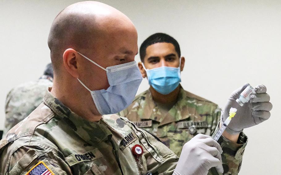 Maj. Sean O'Brien  of  U.S. Army Health Center Vicenza prepares the the garrison's first COVID-19 vaccine, Jan. 8, 2021 in Vicenza, Italy.

