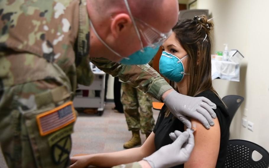 Registered nurse Ashley Reinhold, 26, receives the COVID-19 vaccine Jan. 8, 2021 in Vicenza, Italy. Initial vaccinations will be limited to health care workers and first responders. The process will be assessed to expand distribution.

