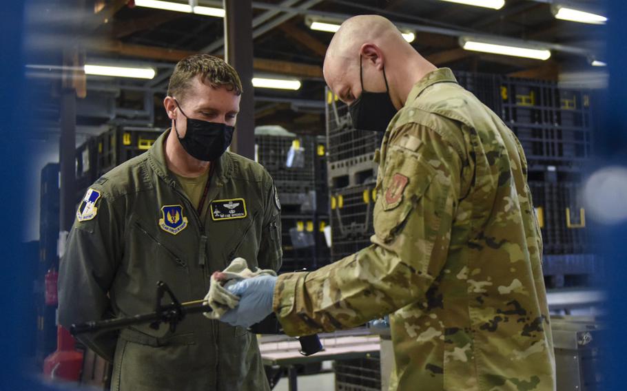 U.S. Air Force Tech. Sgt. Kyle Deconnick, 52nd Logistics Readiness Squadron, shows U.S. Air Force Col. David C. Epperson, 52nd Fighter Wing commander, an M4 rifle once it has been cleaned using an ultrasonic weapons cleaner at Spangdahlem Air Base, Germany, Nov. 9, 2020. 
