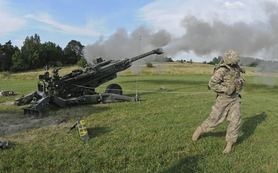 Pfc. Brent Rhodes, a cannon crew member with 2nd Cavalry Regiment, fires an M777A2 howitzer weapons system during an artillery demonstration at Grafenwoehr Training Area, Germany, in 2015. Gen. Christopher Cavoli, commander of U.S. Army Europe and Africa, says the U.S. needs more long-range artillery and other advanced weaponry in Europe.  

