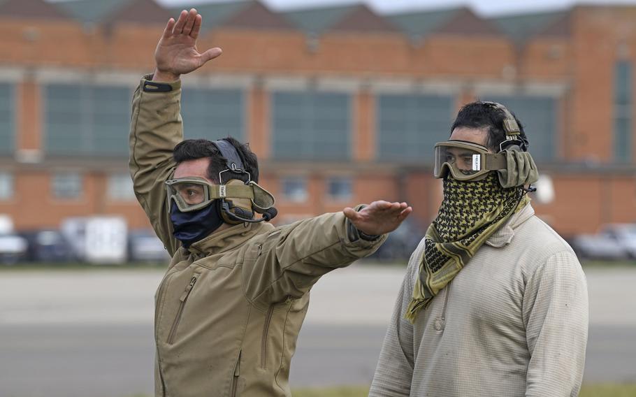 Airmen assigned to the 752nd Special Operations Aircraft Maintenance Squadron guide an aircraft at RAF Mildenhall, England, Oct. 19, 2020. Starting March 1, 2021, the Air Force is extending overseas tour lengths from 24 to 36 months for unaccompanied airmen and Space Force members on their first permanent duty assignment at 22 of its bases in Europe and the Pacific.

