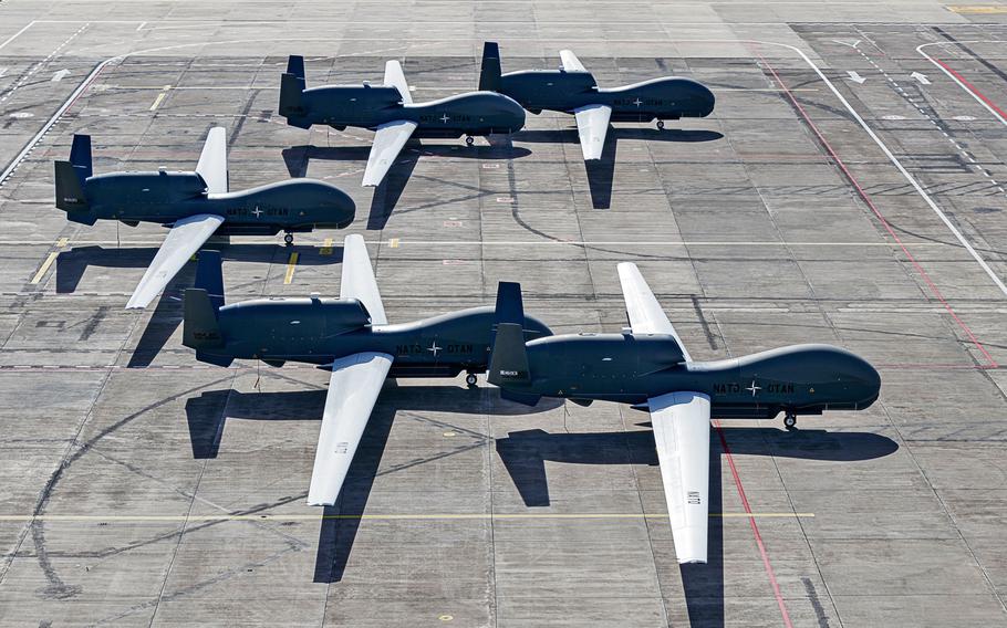 All five NATO AGS RQ-4D remotely piloted aircraft sit on the tarmac at Naval Air Station Sigonella, Italy. 