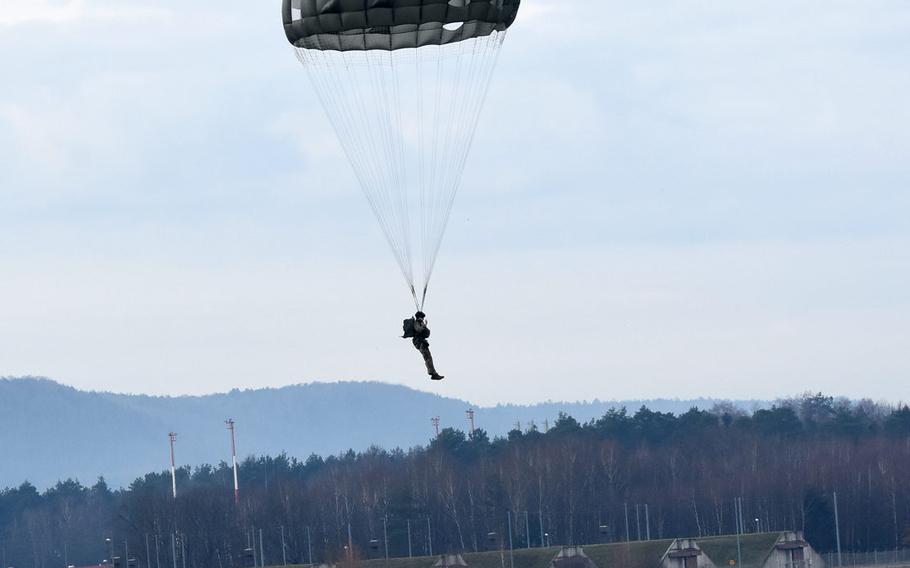 A paratrooper descends onto a grassy area inside the airfield at Ramstein Air Base, Germany, on Thursday, Feb. 18, 2021. Thirty paratroopers from Air Force and Army units in Germany jumped at Ramstein following a short-notice request from the 435th Contingency Response Group to use the airfield after several jumps were canceled due to poor weather and coronavirus restrictions.
