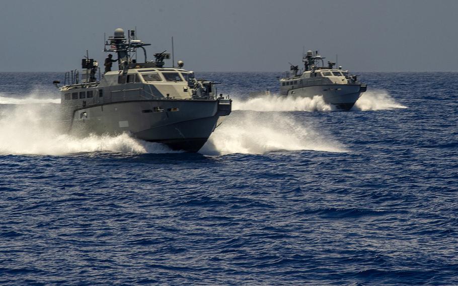 Two Mark VI patrol boats attached to Coastal Riverine Squadron 2 maneuver near Apra Harbor, Guam, in 2019. The Defense Department announced March 1, 2021, that two patrol boats are included in a $125 million military assistance package for Ukraine.

