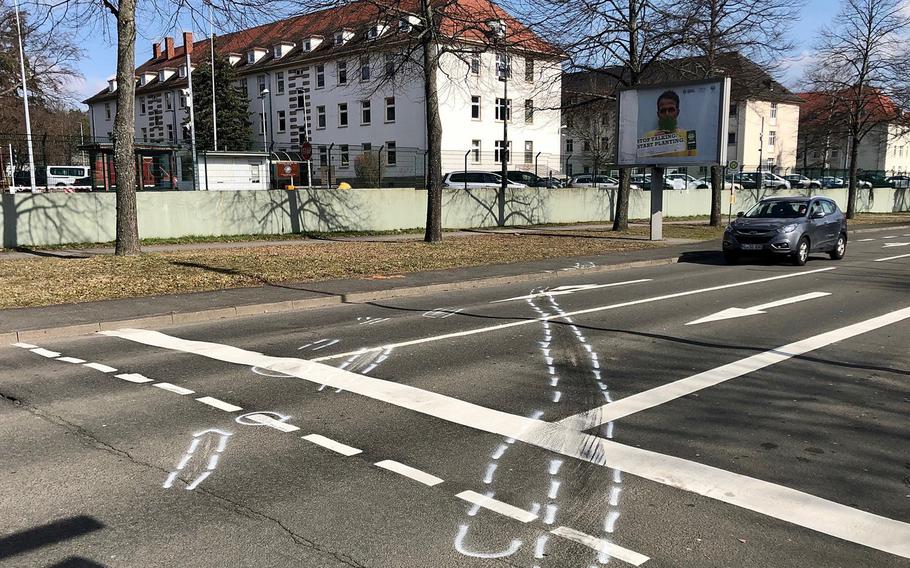 Police chalk marks remain at the intersection of Mannheimer Strasse and Daennerstrasse in Kaiserslautern, Germany, where a U.S. soldier was killed and three others injured in a two-car accident March 5, 2021. In the background is the U.S. Army's Daenner Kaserne.

