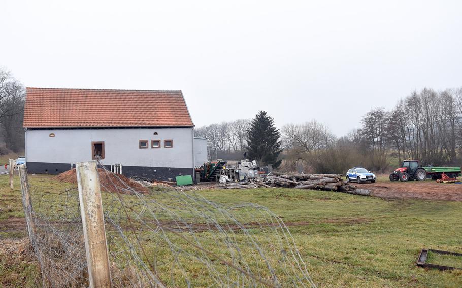 This farmstead on the outskirts of Weilerbach, Germany, is believed to be the scene of a double homicide. Police were still searching for a suspect Wednesday, March 10, 2021, after Kaiserslautern police said two people were found dead inside a residential building in Weilerbach on Tuesday morning. Several police officers were seen walking around these buildings, located on the road going between Weilerbach and Hirschhorn.