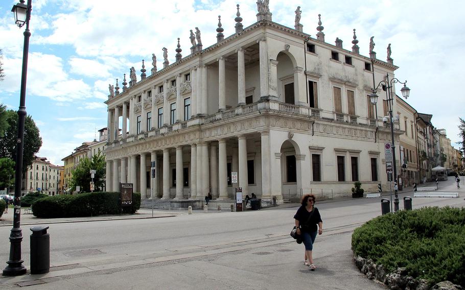 A woman walks near the Palazzo Chiericati Vicenza's municipal art museum. The region that includes Vicenza's U.S. Army Garrison Italy will be declared a red zone Monday by the national government, which would mandate tougher coronavirus restrictions. 

