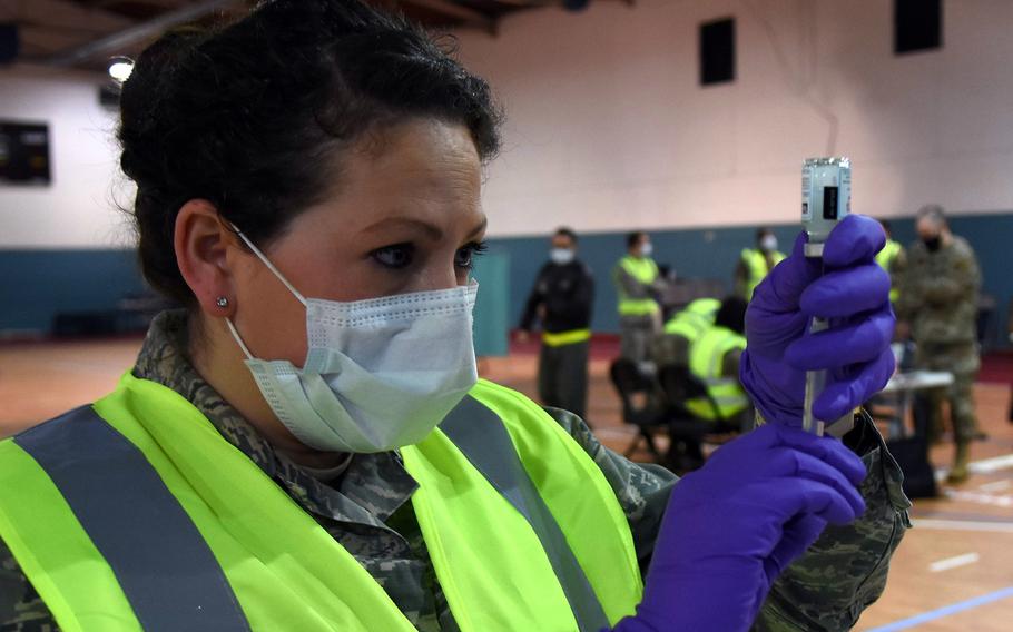 Staff Sgt. Jessica Campfield, an allergy immunizations technician with the 86th Airlift Wing, prepares a dose of the Moderna vaccine in January 2021, at Ramstein Air Base, Germany.