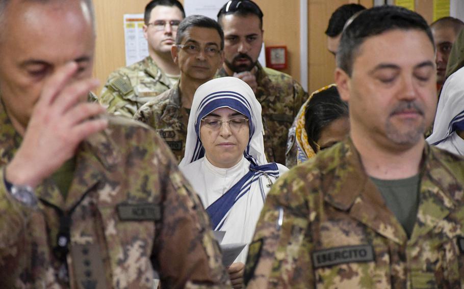 Nuns and U.S. service members attend Easter Mass at Resolute Support Headquarters in Afghanistan, in April 2019. A year after the coronavirus led to many celebrations of Easter and Passover being canceled, U.S. military chaplains around the world will mark the Christian and Jewish holidays through in-person and online services. 