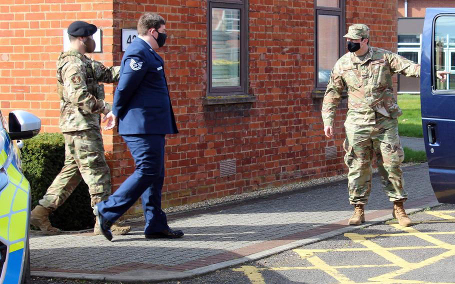 Tech. Sgt. Garret Souders is escorted following his court-martial at RAF Mildenhall, England, March 25, 2021. Souders was sentenced by a military judge to nine years in prison after being found guilty of charges related to possession and viewing of child pornography.

