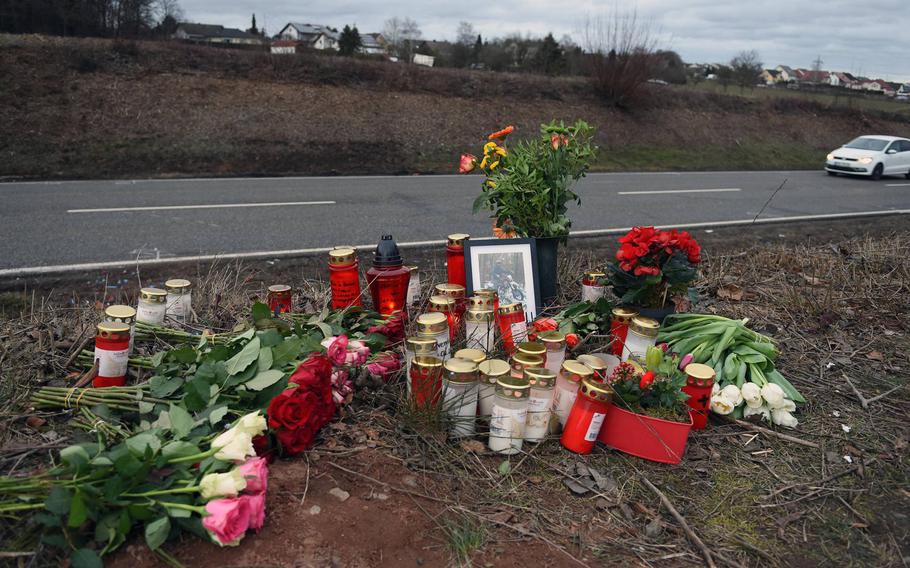 A roadside memorial of flowers and candles was created for David Wirsching, a German teenager killed in a car crash near Weilerbach, Germany, in February 2019. 