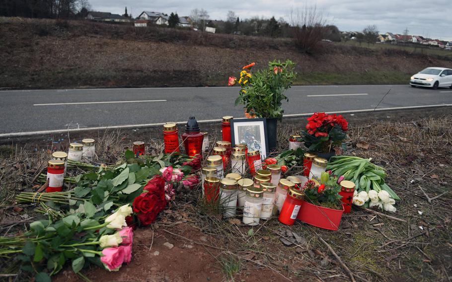 A roadside memorial of flowers and candles was created for David Wirsching, a German teenager killed in a car crash near Weilerbach, Germany, in February 2019.