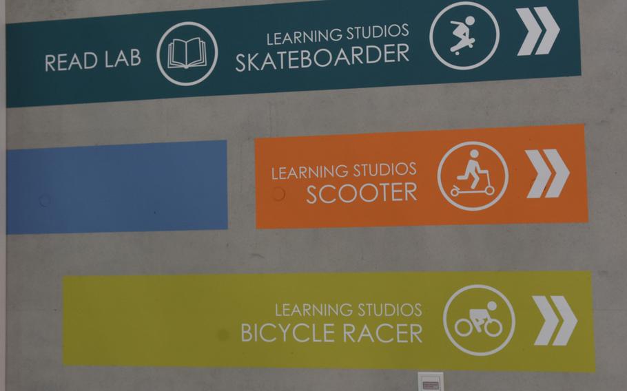 Color-coded signs use a transportation symbol to guide students by grade level to their classrooms, which in the new Kaiserslautern Elementary School are called ''learning studios.''

