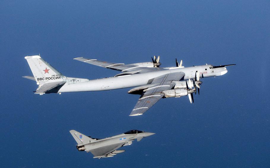 A Russian Tu-95 Bear aircraft is escorted by a U.K. Royal Air Force Typhoon during an intercept in September 2014. NATO fighter jets scrambled 10 times on Monday, March 29, 2021, to shadow Russian bombers and fighters over the North Atlantic, North Sea, Black Sea and Baltic Sea. 